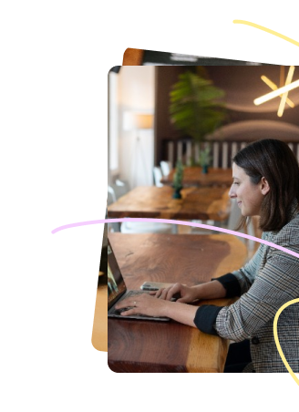 A woman looking satisfied while on a meeting on her laptop